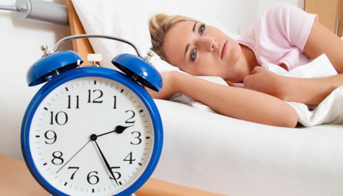woman suffering from insomnia caused by stress