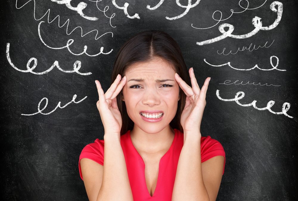 Stress - woman stressed with headache